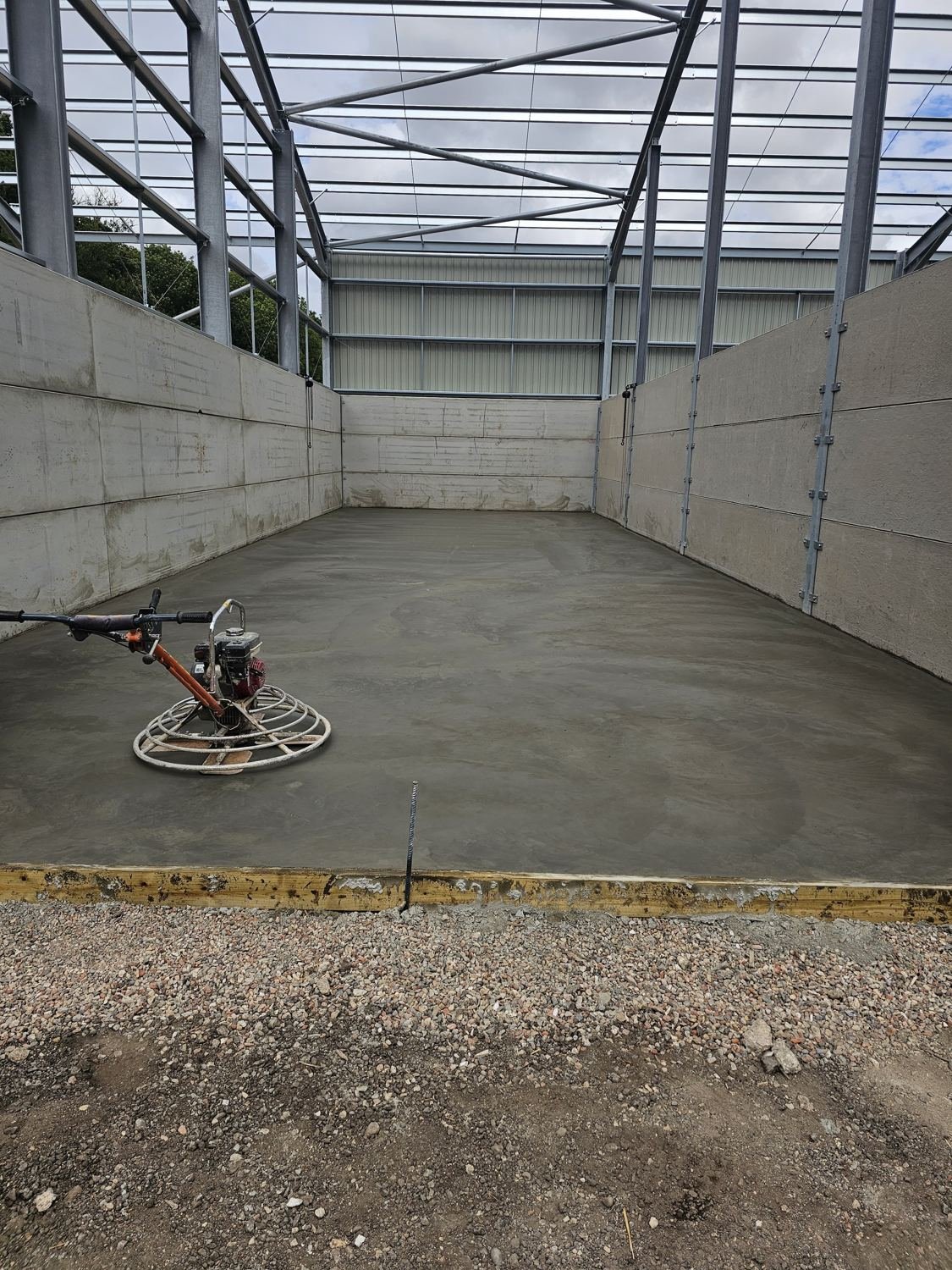 Freshly floated level concrete slab with formwork edge