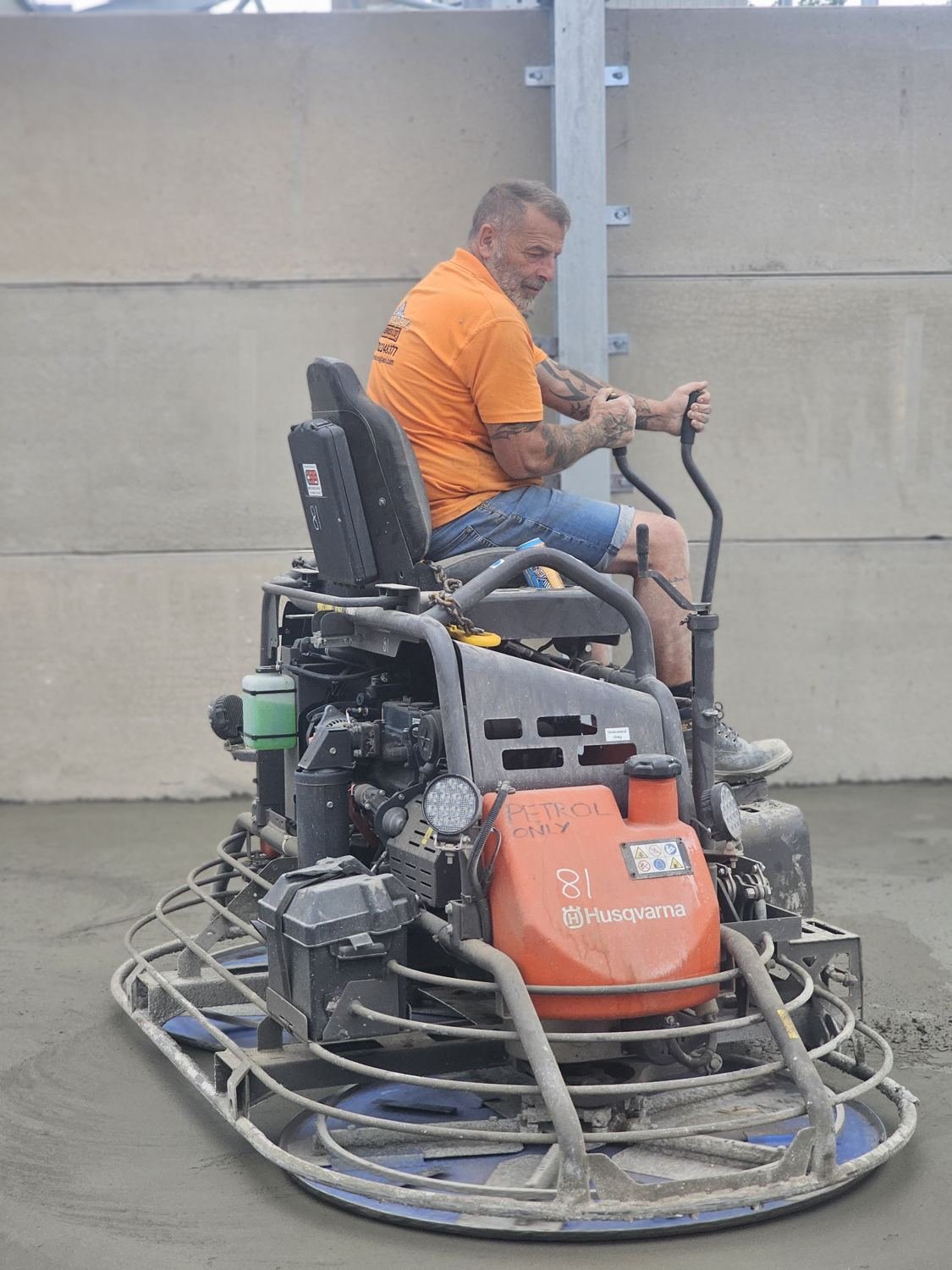 Husqvarna ride-on power trowel in use